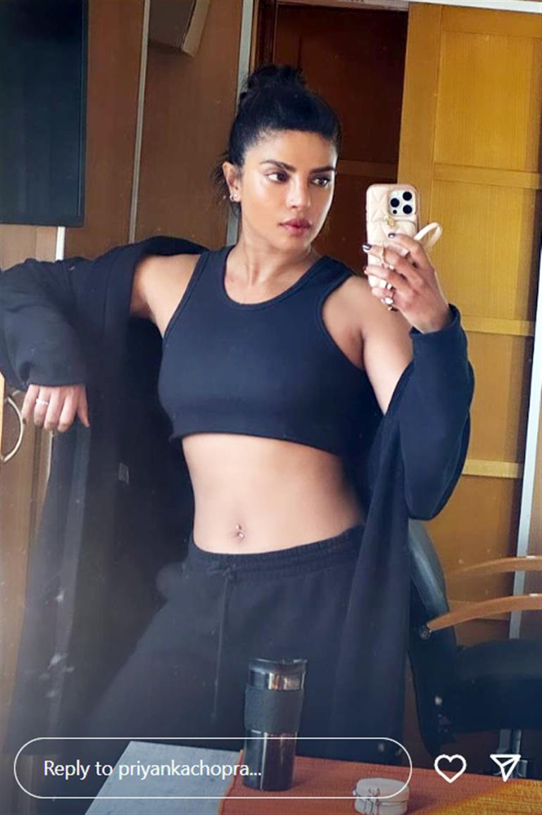 Priyanka Chopra flaunts her toned muscles in 'between shots selfie' from the Heads of State set