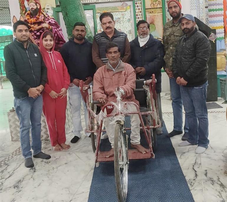 Tri cycle donated by baba Lakhdata Darbar committee